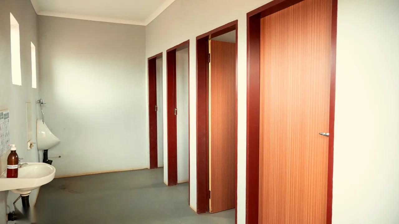 Washbasin, urinal and toilet cubicles inside the ablution block